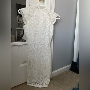 Tight fitting white dress.